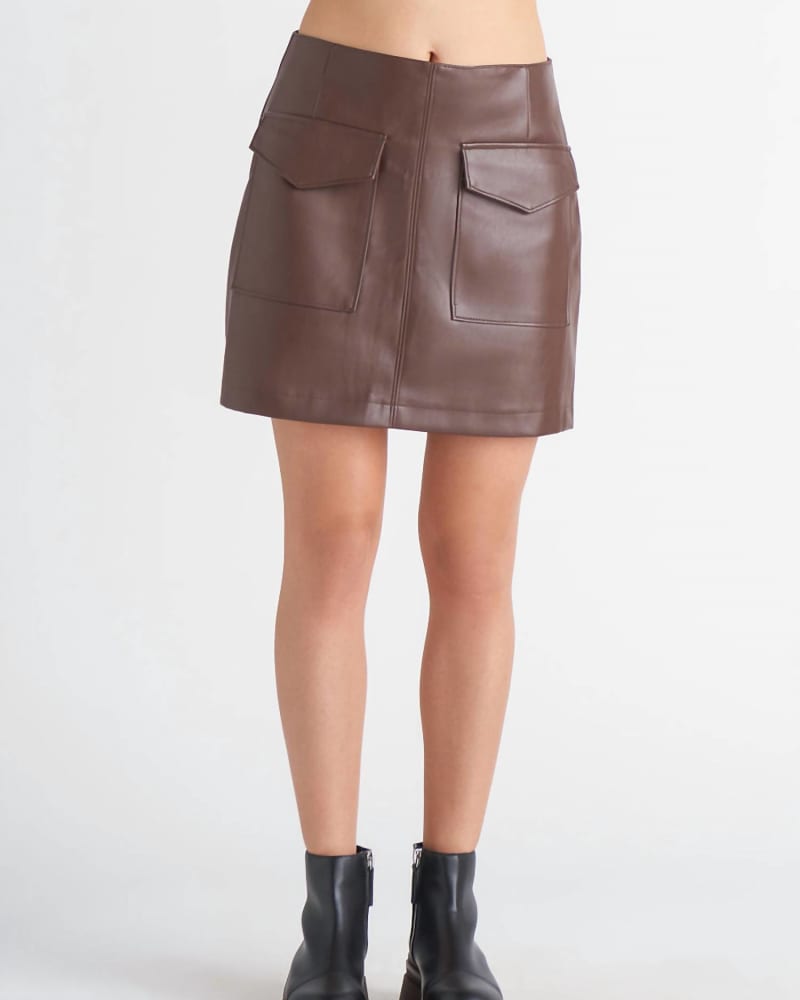 Front of a model wearing a size XL Faux Leather Mini Skirt In Rustic Brown in Rustic Brown by Dex. | dia_product_style_image_id:353313